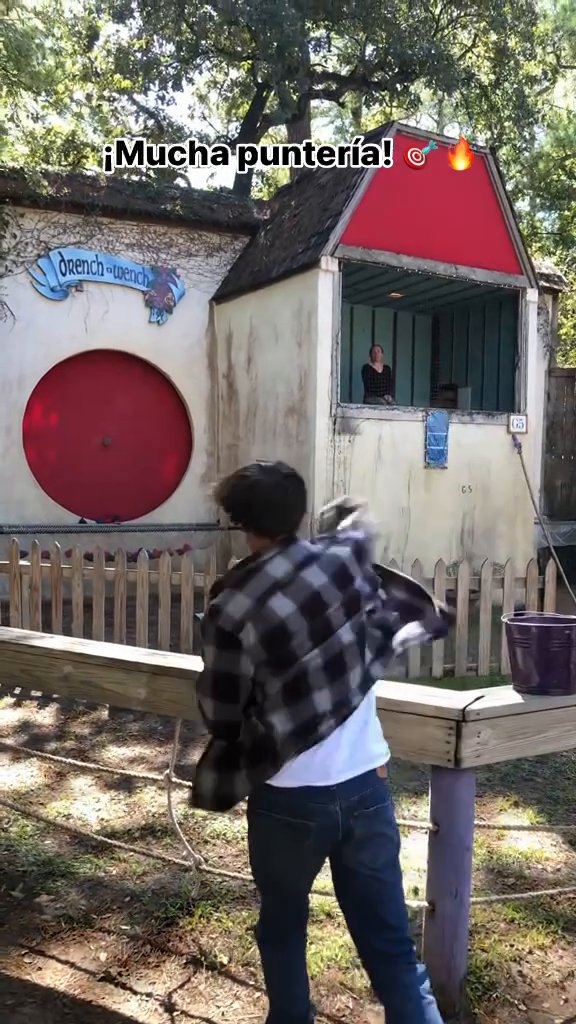 This guy’s trying to dunk this woman by hitting a target. He misses, she goes, “this is why you can’t get a girlfriend.” Next attempt, he nails it. She drops.