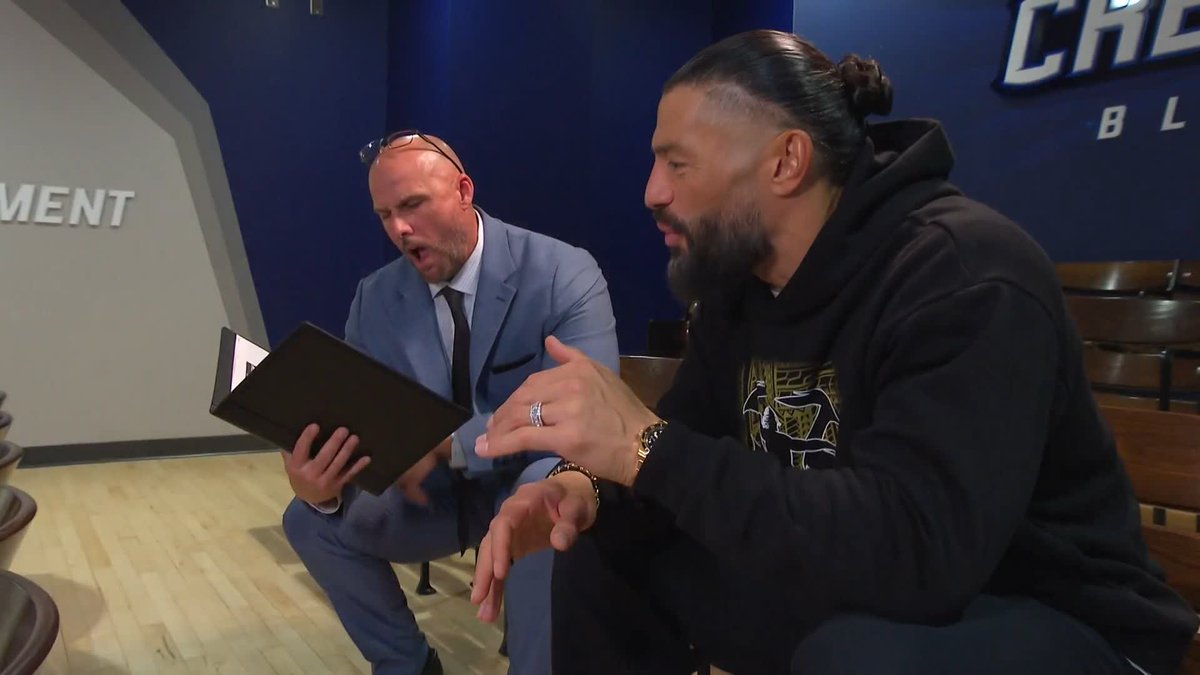 .Roman Reigns is BUSY going over the #WWEBacklash contract with Adam Pearce ✍️
