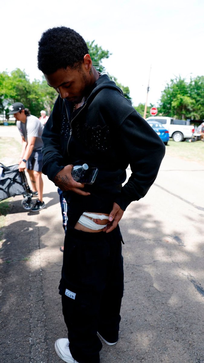A weekend shooting at a lakeside park in Oklahoma that left nearly two dozen people injured erupted when a group began arguing at an unsanctioned party packed with young adults, a witness said Monday.