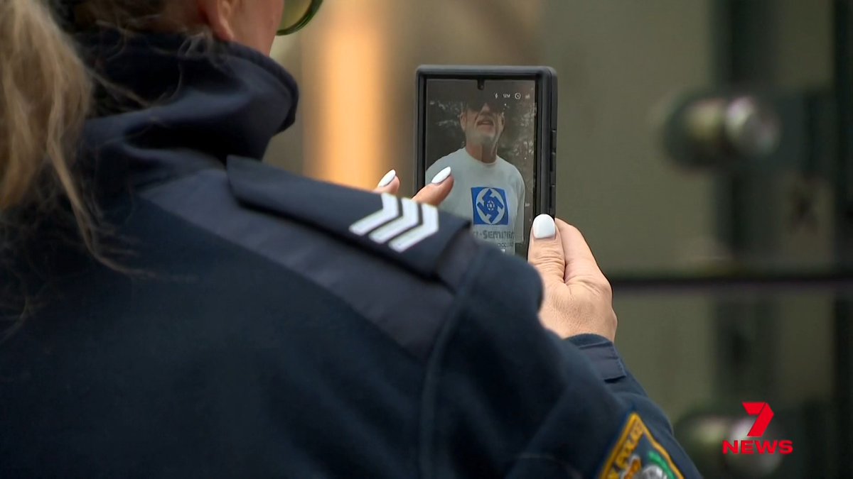 A man wearing a swastika T-shirt outside the Royal Commission on antisemitism has been arrested after witnesses, including children, gave evidence at the inquiry.