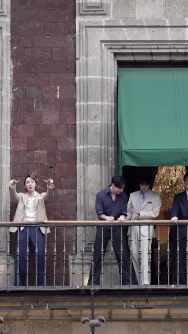 K-pop group BTS appeared on a balcony of Mexico's National Palace on May 6, greeting thousands of fans gathered in the capital after a meeting with President Claudia Sheinbaum.