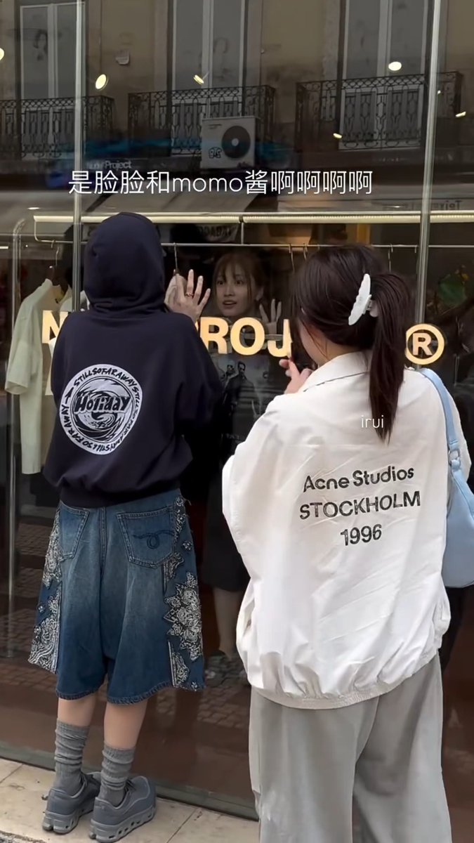 A fan bumping into Nayeon and Momo in Lisbon and seeing them doing whatever in the shop window for the Europe vlog 😭