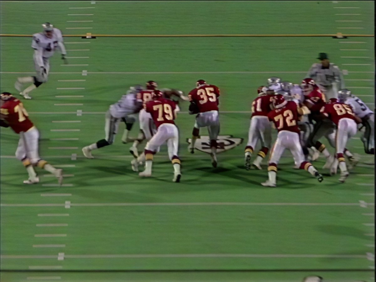 1992: On MNF vs the Raiders, Christian Okoye hits Ronnie Lott so hard the HOF safety needs smelling salts to get back in the game.
