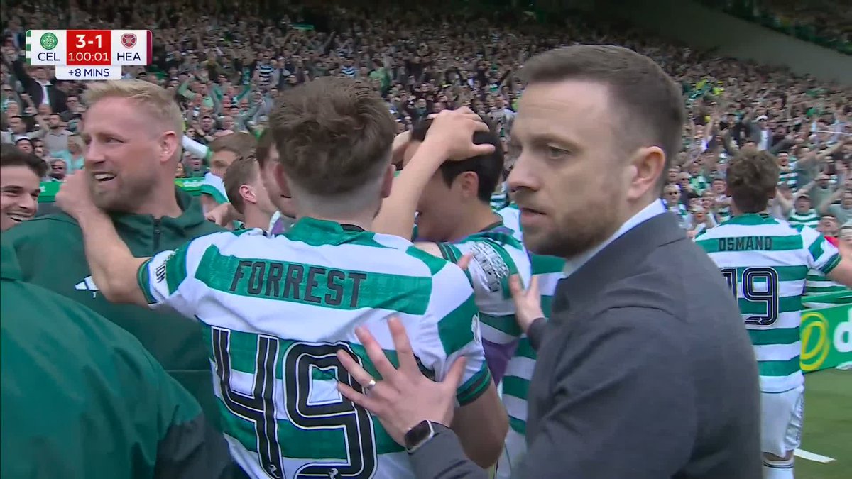 Celtic players and fans celebrate their title win at the full-time whistle 🍀