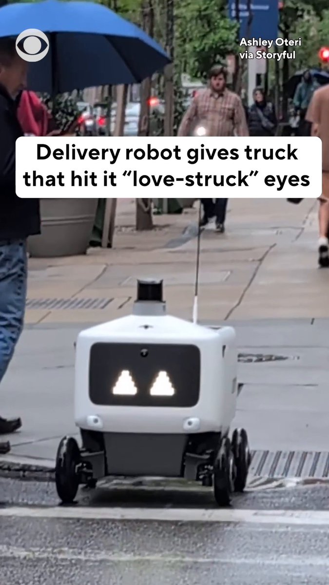 A delivery robot was “love-struck” after it was hit by a car while crossing a street in Philadelphia. The robot can be seen emerging from the hit nearly unfazed with heart eyes, but it did seem to suffer a dislodged tire as it continued on toward its destination.
