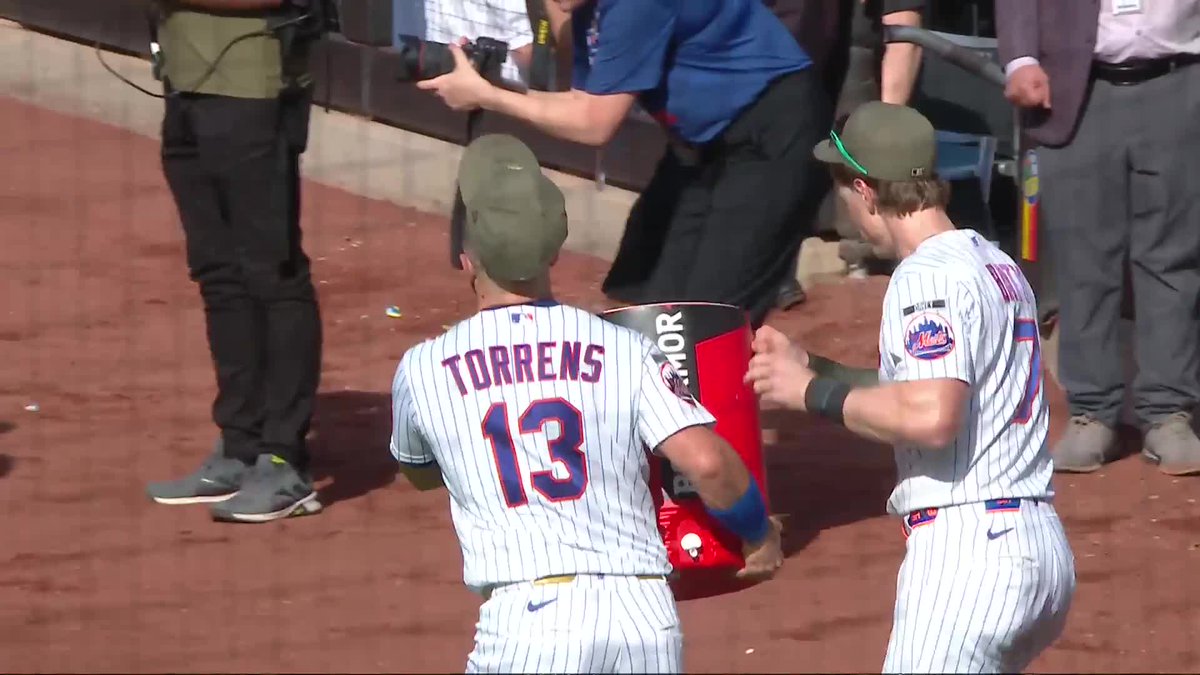 Brett Baty and Luis Torrens hit Tyrone Taylor with the BodyArmor shower after the Mets' win 💦
