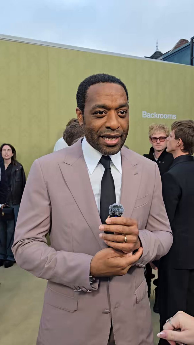 Chiwetel Ejiofor says he got excited to be on the ‘BACKROOMS’ set after seeing how joyful Kane Parsons was to work on them. “I was very late to understand that this was the first physical set for the Backrooms, I thought seeing the shorts that somewhere it had been built before”