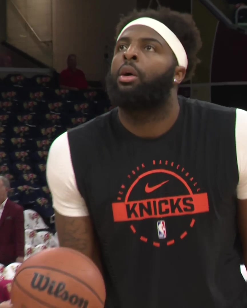 Mitchell Robinson works from the foul line in pregame warmups