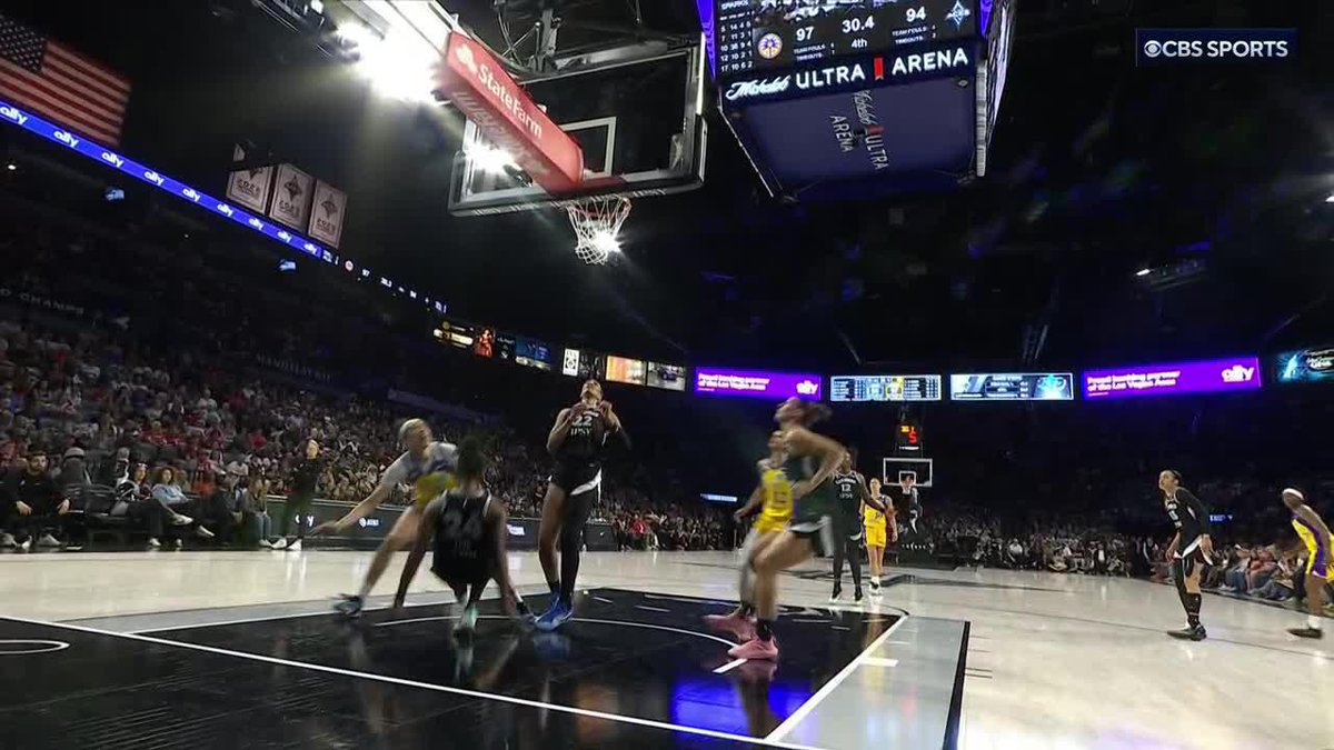 The call of charge was overturned to a blocking foul after the Sparks challenged.