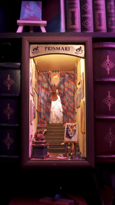 A book nook inspired by Prismari, where creativity takes center stage. #MTGStrixhaven 🎨Book nook by David Miniatures