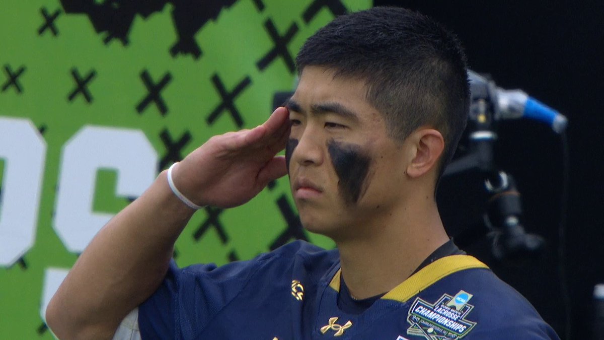 Notre Dame attackman Josh Yago standing at attention during the national anthem ahead of the NCAA Men's Lacrosse National Championship on Memorial Day ๐บ๐ธ Yago is a graduate transfer from Air Force, and is also a second lieutenant in the U.S. Space Force.