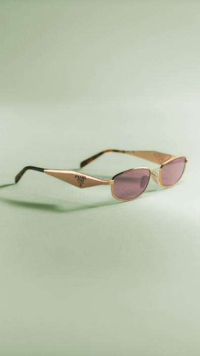Lightweight metal, a low oval front, and sophisticated lenses define a sleeker side of Prada Eyewear. Discover more: #PradaSummer #PradaEyewear #Prada