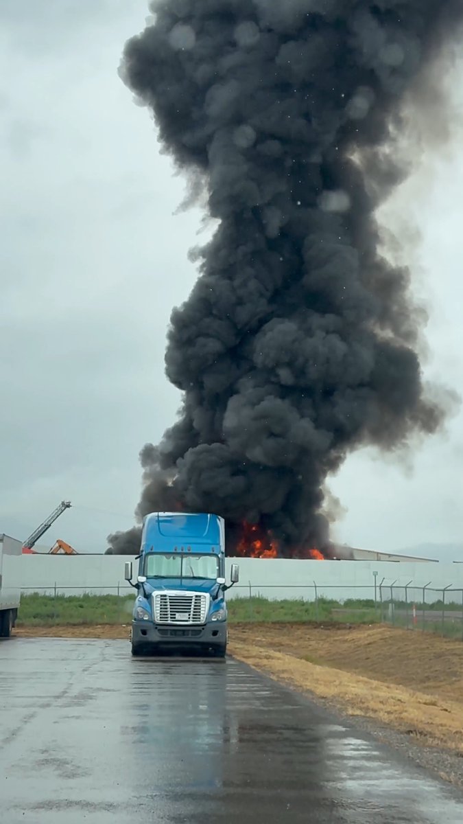 At least 100 vehicles on fire as officials respond to structure fire at Axmen Recycling near Wye, Montana; injuries unclear.