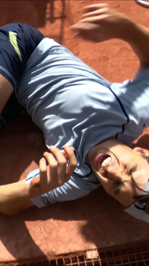 Zachary Svajda collides with the umpire chair during his match against Flavio Cobolli at Roland Garros