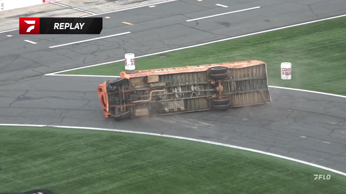 💥 School Bus tips over at Charlotte Motor Speedway! #CookOutSSO