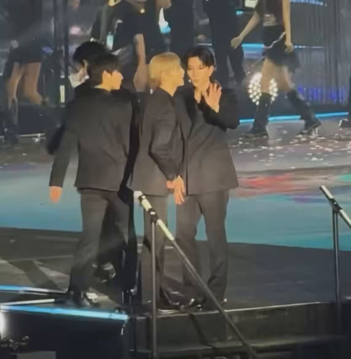 that time when jungwon was about to fall off the stage so heeseung quickly grabbed him moving him to his right, taking his place near the edge instead 🥹