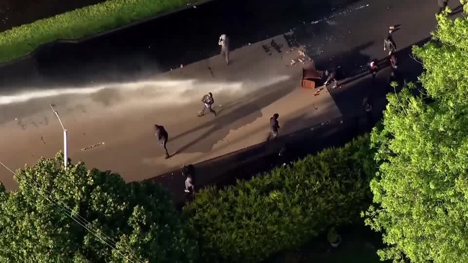 Police deployed a water cannon on protesters in Belfast after anti-immigrant violence erupted following a knife attack by a Sudanese man in the Northern Ireland capital