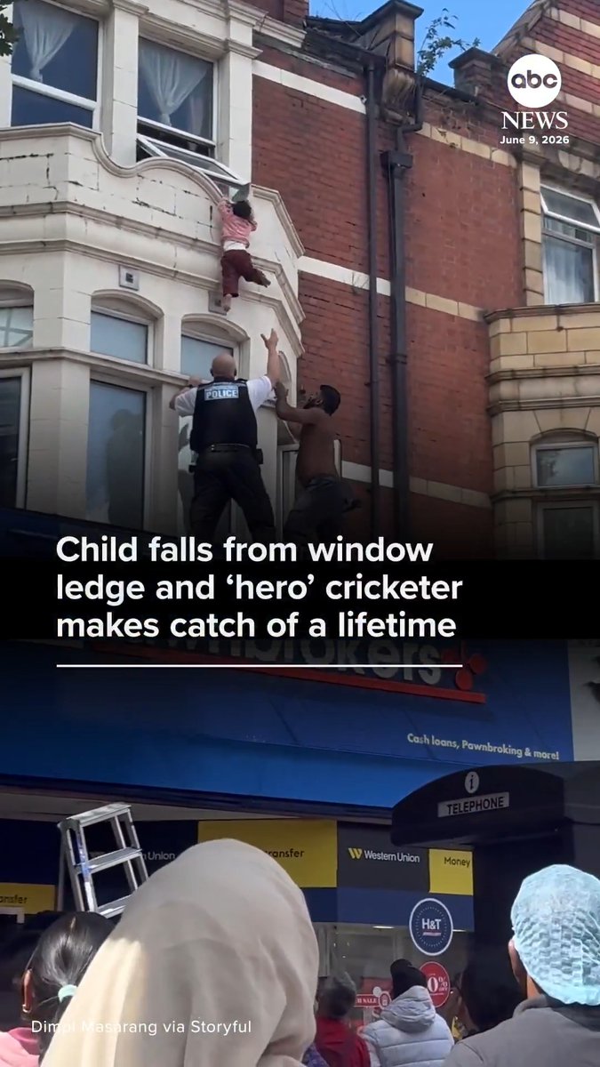 Eyewitness footage captured the terrifying moment a young girl fell from the balcony ledge of an upper-floor apartment in London, England, as a neighbor and police officer waited to catch her below.
