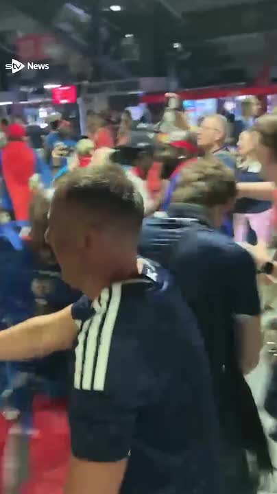 Tartan Army dance with Haitian fans after the game