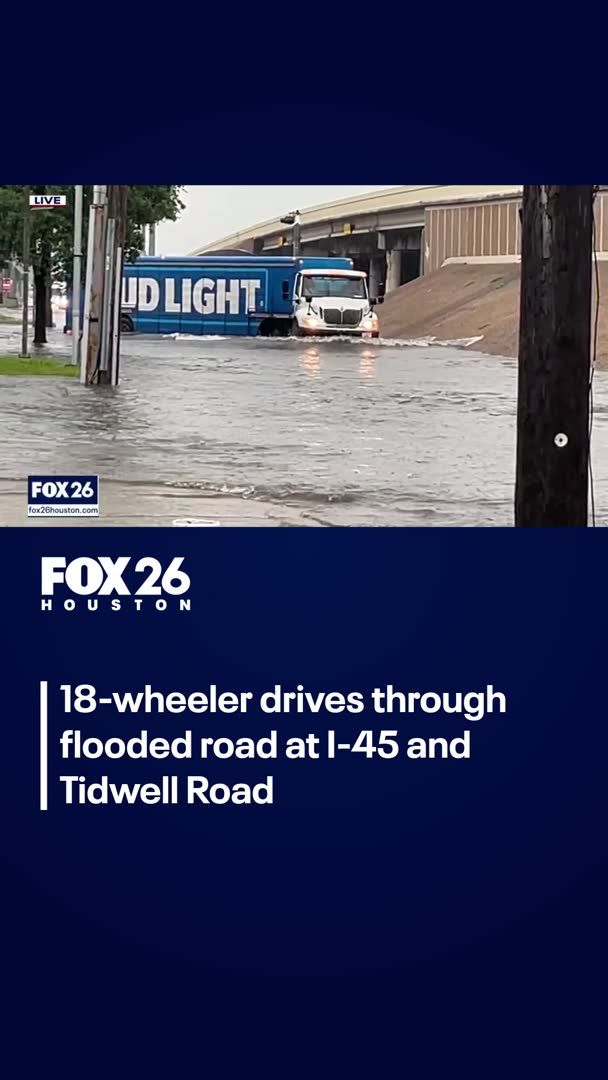 An 18-wheeler shows it has no trouble driving through high water at I-45 North and Tidwell Road.