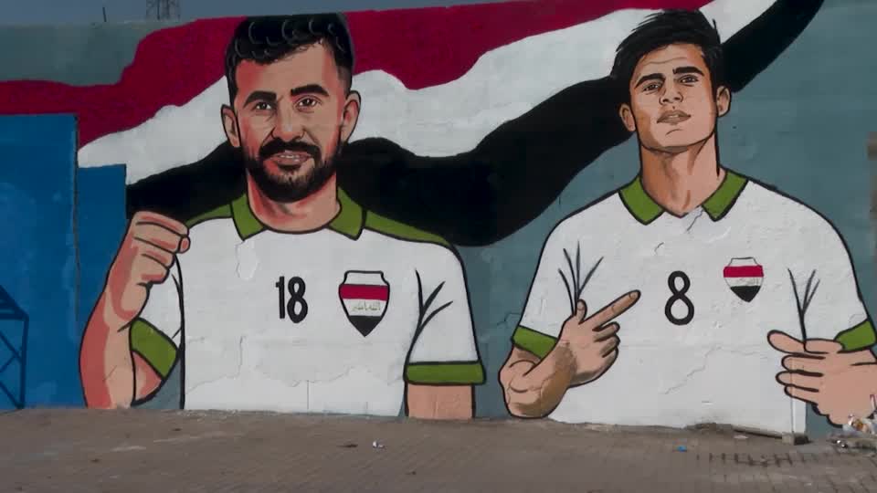 Iraq's national soccer team was honored with murals in Baghdad's Sadr City as volunteers mark the team's first World Cup qualification in four decades