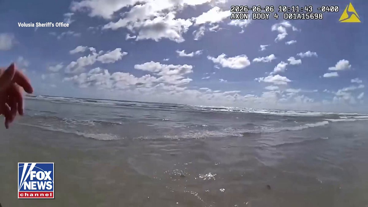 Two Florida cops are being hailed as heroes for rescuing a drowning woman. A 68-year-old woman collapsed face-first in the ocean, and seconds later, the two deputies raced into the surf to save her. Volusia County Deputy Gourley spotted the woman unconscious and floating about 30 feet offshore after beachgoers flagged him down. He pulled her to shore, where Deputy Manhart immediately started CPR. Dramatic body camera video captured the heart-stopping rescue as witnesses cheered the deputies on. Officials say the 68-year-old is expected to recover thanks to the deputies’ quick actions and the coordinated emergency response.