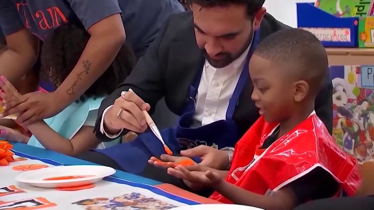Tiny Knicks fans in Brooklyn gave New York's basketball heroes a hand, literally, as children decorated a parade banner with blue and orange handprints ahead of the team's ticker-tape parade