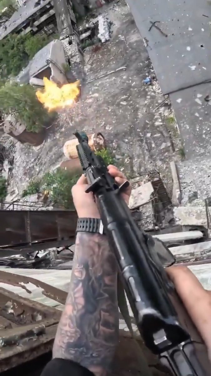 Reportedly footage of a Russian soldier rocking some flip flops taking out a Ukrainian drone 🎯💥 Related note - do y'all think that a single baffle suppressor or just a gas booster type muzzle device? I'm thinking a single baffle can but a lot of the silencers over there are unbranded and made on a local lathe so it's hard to say... #war #russia #drone #ukraine #AK74 #kalashlife #FlipFlops #booster #silencer #545x39 #7N6