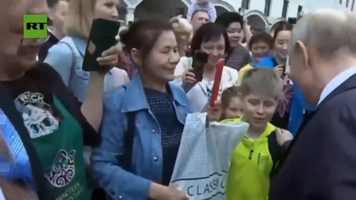 Vladimir Putin greets CHEERING CROWD as he arrives in Kazan for ASEAN summit 'Where did you come from?' — Putin greets a young boy, who replies 'Moscow!' 'Me too, just now'