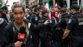 Hate fest back in Montreal, featuring Islamic street prayer Activists from Montreal4Palestine returned to the city's streets following a short hiatus after a controversial May 24 rally drew backlash from even those who normally support the radical activist group. After weeks of silence following one of the most controversial demonstrations seen in the city since October 7, Montreal4Palestine is back. On June 14, the activist group held another protest at Place des Arts, marking its first major demonstration since the uproar surrounding the May 24 rally where organizers staged hanging effigies of public figures. What followed was widespread condemnation, a reported police investigation, and a public relations crisis that even appeared to fracture support among some of the group's usual allies. Videos from the May 24 protest quickly spread online, showing what many observers described as the effigy of a Jewish man hanging from a structure. The images sparked outrage across the political spectrum and prompted Quebec Public Security Minister Ian Lafrenière to confirm that authorities were looking into the incident. Montreal4Palestine later claimed the effigy was intended to represent Israeli National Security Minister Itamar Ben-Gvir, not simply a Jewish man wearing a kippah. But the explanation did little to quiet the backlash. Then something unexpected happened. The National Council of Canadian Muslims (NCCM) — an organization that has rarely criticized Montreal4Palestine publicly despite months of controversial protests, confrontational demonstrations, and street prayer events — released a statement condemning what it called repeated acts of violence in Montreal, including the use of hanging effigies depicting political figures. And that's what makes this story so remarkable. When even the NCCM is distancing itself from Montreal4Palestine and referring to such activists as "marginal fringe groups," it raises an obvious question: has Montreal4Palestine finally gone too far, even for some of its traditional supporters? Or is the sudden condemnation connected to the fact that police have now confirmed an investigation into the May 24 incident? Back on the streets on June 14, familiar faces returned once again. The demonstration was led by Bara Abuhamed, alongside his father, Imam Iyad Abuhamed, who was once again heard calling for jihad during the event. One attendee was seen wearing a shirt referencing Abu Obaida, the spokesperson of Hamas's military wing, alongside imagery associated with the October 7 Hamas attack on Israel. When questioned about the shirt, police officers told Rebel News they would look into the matter. The group also once again blocked Saint-Catherine Street to conduct its now-familiar public prayer gathering, this time without prostration. Police monitored the event but did not intervene, despite Quebec's recently adopted Bill 9, which restricts certain public prayer activities on streets and other public spaces. Rebel News was on the ground covering the demonstration with private security present, as threats and hostility toward independent journalists remain a recurring reality at these events. FULL REPORT by Alexandra Lavoie :