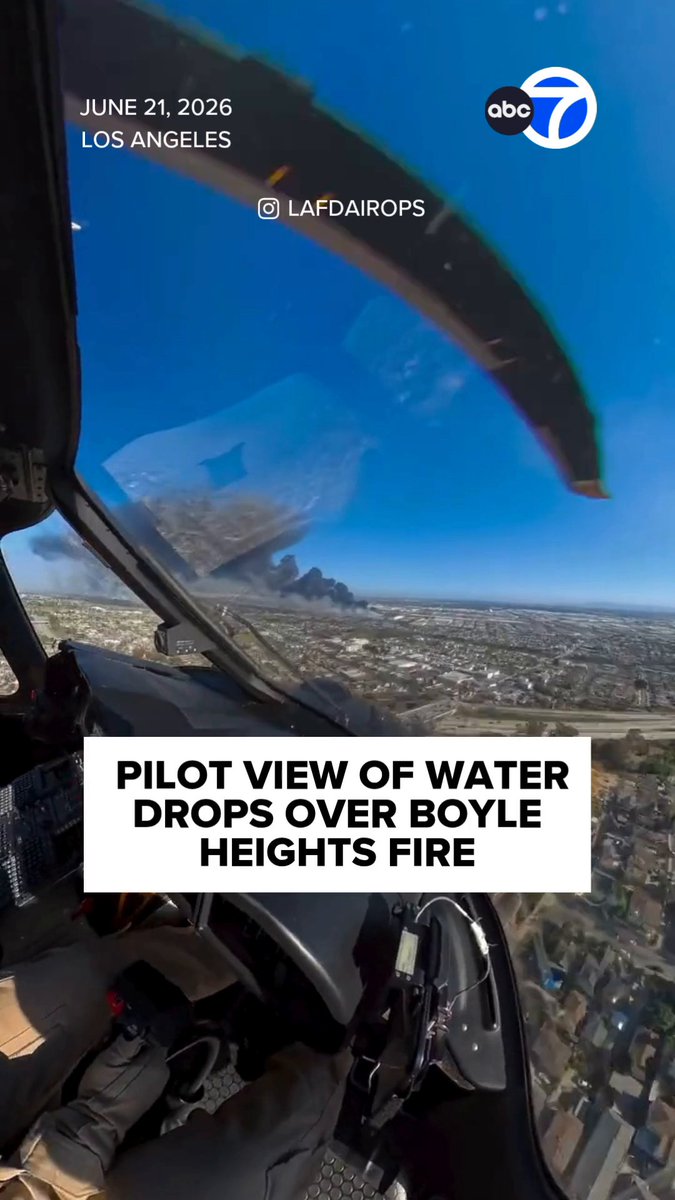 New video is offering a closer look at the ongoing firefight in Boyle Heights. The footage shows the pilot's perspective from inside a Los Angeles Fire Department helicopter as crews drop water. The images highlight the scale of the incident, including a massive smoke cloud visible from a significant distance.