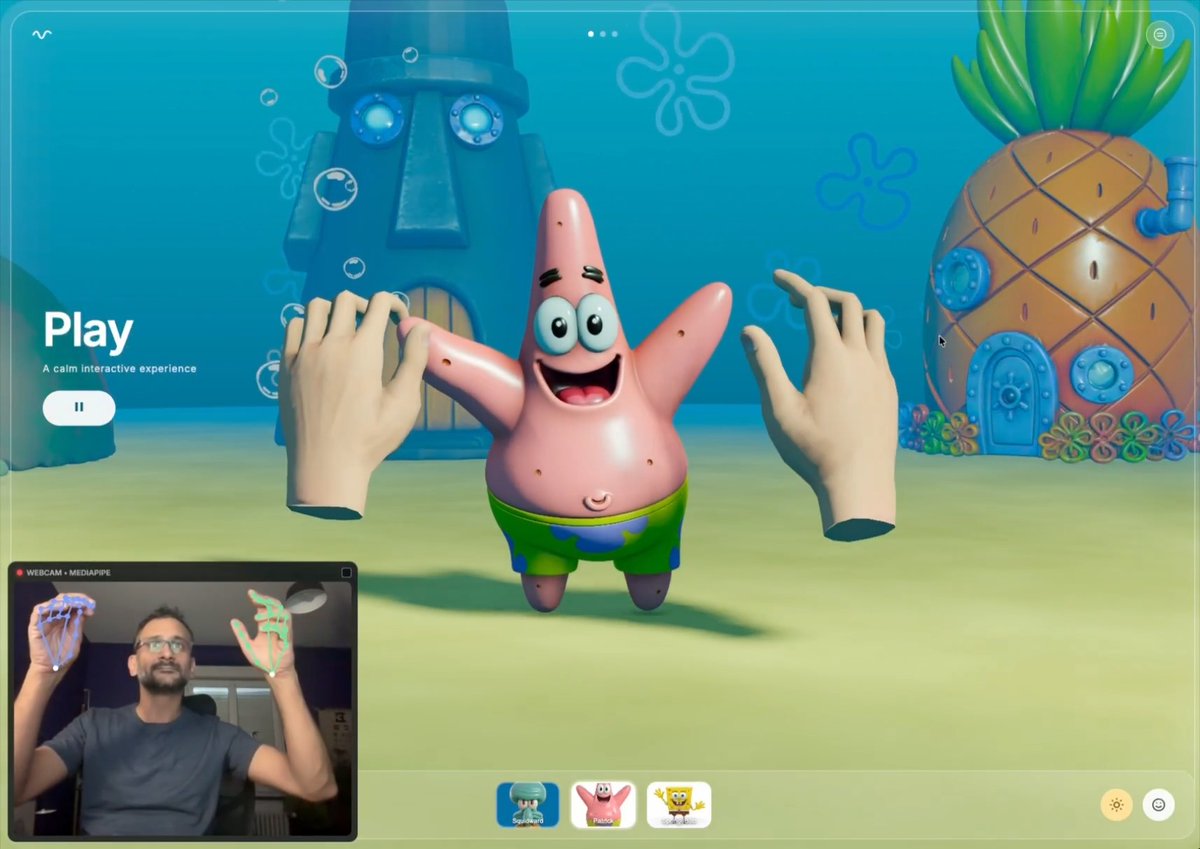 Day 2! 🖐️ The hand tracking experiment in your browser keeps growing. Added a character gallery, Patrick and SpongeBob now stand alongside Squidward, along with their houses, a bubble particle system, and extra assets. Honestly, building with Omma AI right now is just too much fun. #threeJs
