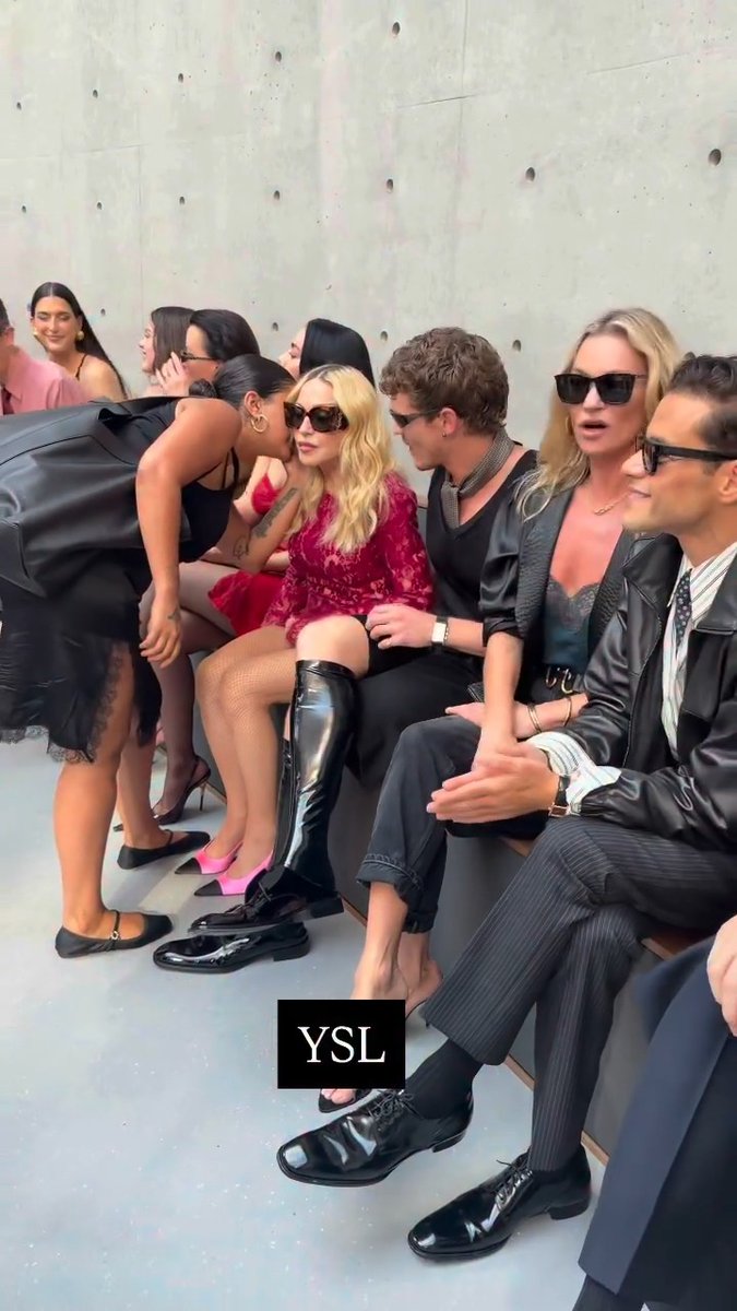 Madonna and Connor Storrie are sitting next to each other at the Saint Laurent Paris Fashion Week show - and the internet is obsessed with it 🤩 Fans are thinking the 'Heated Rivalry' star, 26, may have manifested it with his viral 'Like a Prayer' lip sync video, going from superfan to friend in the blink of an eye 💖 The pair sat between Charlie XCX and Kate Moss, everyone looking stunning in the front row at the runway 🌟 📽️ : loicprigent #ParisFashionWeek #Madonna #ConnorStorrie