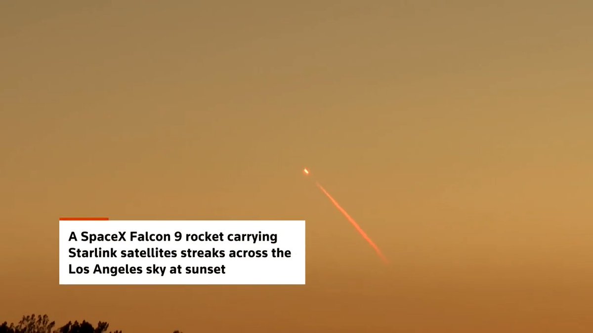 A SpaceX Falcon 9 rocket carrying Starlink satellites streaks across the Los Angeles sky at sunset
