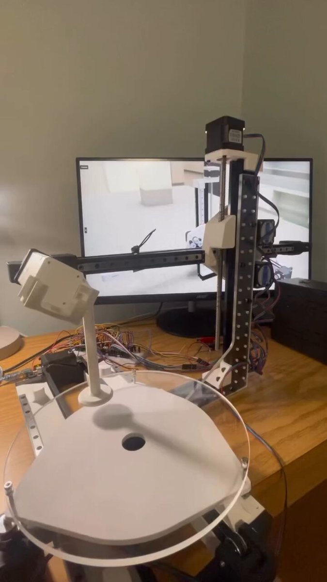 This 3d printer prototype has five axes. The bed spins and slides, the arm holding the nozzle moves up and down in and out, and tilts. Here, the translational degrees of freedom (XYZ) are held constant while the angular ones are allowed to change, essentially orbiting a point.