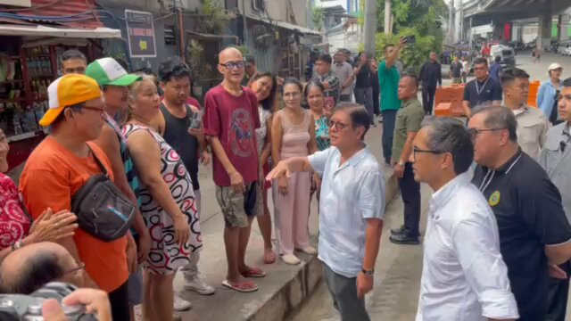 Pres. Ferdinand Marcos Jr. interacts with families near the flood-prone G. Araneta Avenue in Quezon City and inspects the rehabilitated drainage system in the area. | via Harlene Delgado (🎥: MPC pool)