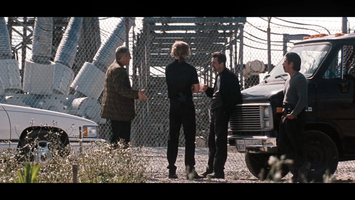 In the original Heat screenplay, when Neil McCauley realizes that he and his crew are under LAPD surveillance, he has them regroup at their usual diner, but Michael Mann instead chose to shoot the scene outside the La Fresa Electrical Substation – for a very specific reason. That substation is basically a giant electrical junction box for the city. It takes in extremely high‑voltage electricity from transmission lines connected to power stations, then redistributes it through the local grid. In the process, it generates so much electromagnetic interference that it can scramble any listening devices that might have been planted on the crew or their cars.