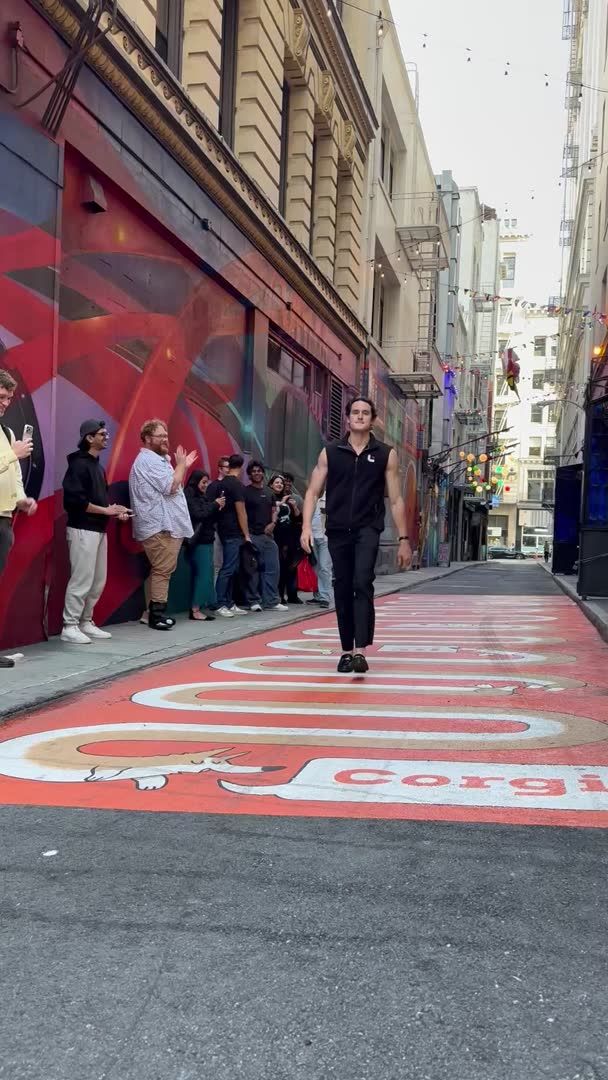 In an alley outside SF's Corgi Cafe, a 24-hour coffee shop operated by an AI insurance startup, around 50 people lined up Thursday evening to admire the latest tech company swag. Here's a taste of what that entailed. See more: