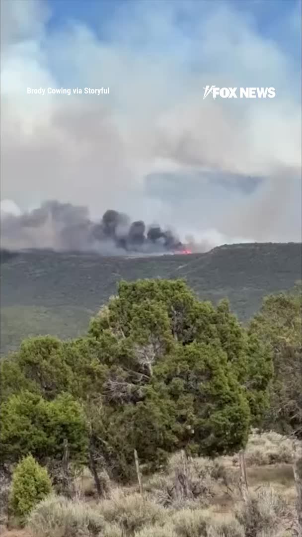 The largest active wildfire in the U.S. has now exploded to more than 92,000 acres in Utah... and it's still 0% contained according to authorities as of Saturday night. New video shows thick smoke billowing over the Cottonwood Fire as flames continue tearing through Piute and Beaver Counties. The fast-moving wildfire comes as Gov. Spencer Cox declared a state of emergency and temporarily restricted fireworks statewide, warning this year's fire conditions are unlike anything firefighters have seen before.