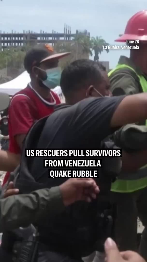 United States search and rescue team members pulled a father and his young son from the rubble on Sunday in Venezuela's state of La Guaira, days after two powerful earthquakes hit the country.