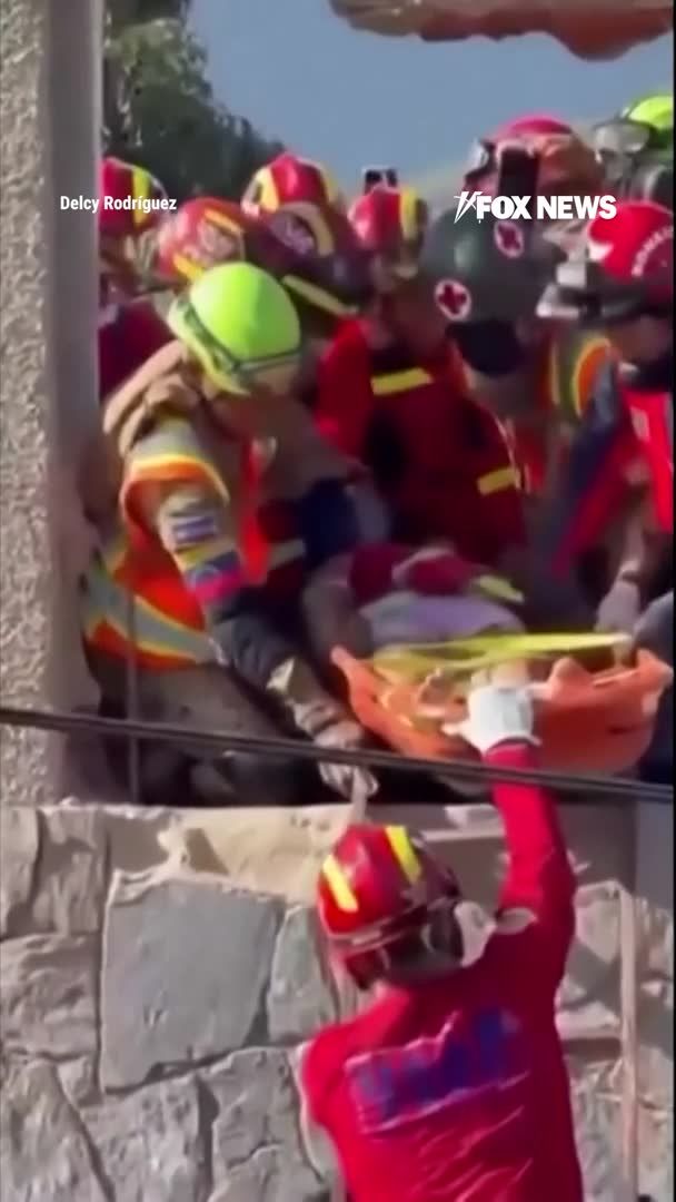 Rescue workers in Venezuela pull a survivor to safety after she was buried under the rubble of a collapsed building for four days. Emergency workers rescued a woman from the wreckage in La Guaira, one of the areas hardest hit by last week's devastating earthquakes. The emotional rescue offers a rare moment of hope as crews continue searching through the destruction, with the death toll climbing to nearly 1,500 and thousands still unaccounted for.