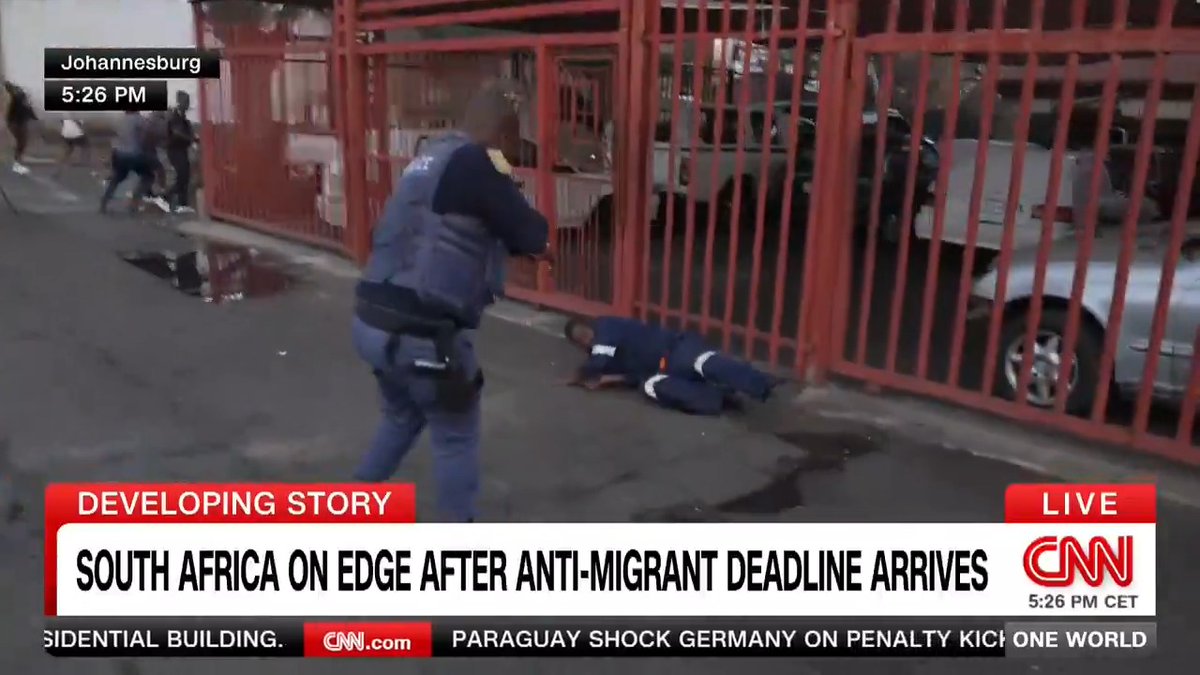 BREAKING: South African police fire rubber bullets to disperse protesters looting a home live on CNN during anti-migrant march