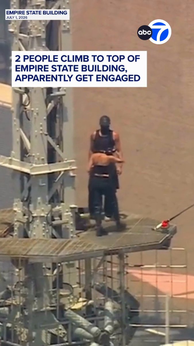 After two people climbed to the top of the Empire State Building and unfurled a banner on top of its spire Wednesday afternoon, one of the climbers appeared to propose to the other.