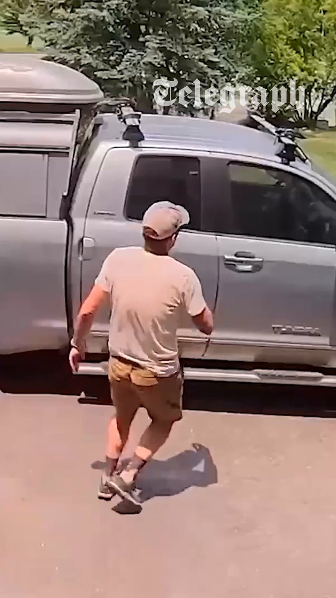 Andy Kerrigan, of Steamboat Springs in Colorado, came face-to-face with the small black bear in the front of his truck after returning from a walk. 🔗: