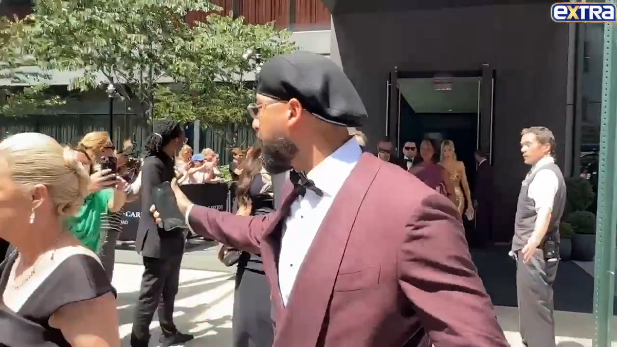 Travis Kelce's best friend Ross Travis sports a wine colored tux as he heads to Travis & Taylor Swift's wedding celebration at Madison Square Garden. (🎥: Backgrid)