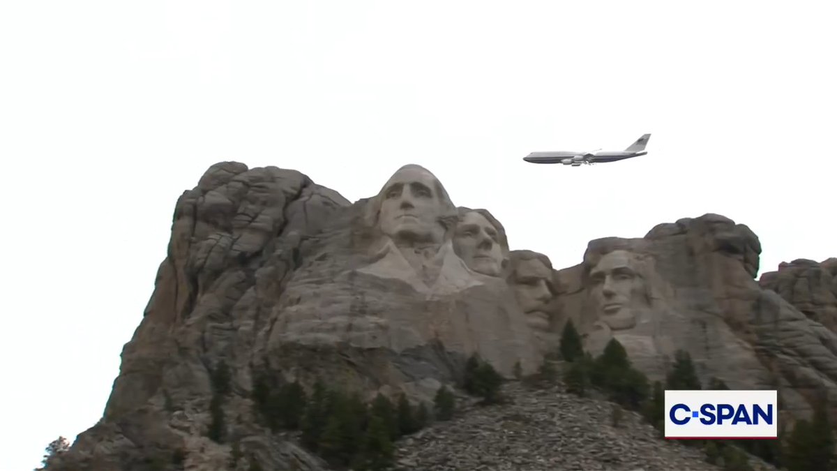 Air Force One flies over Mount Rushmore.