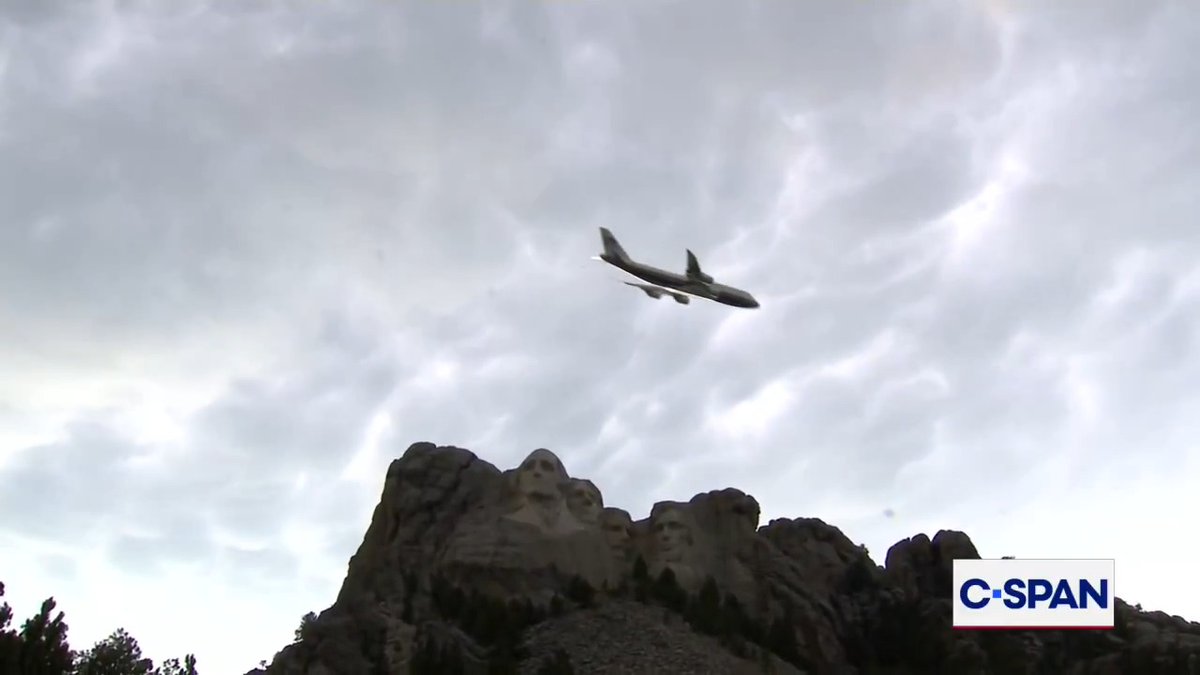 Air Force One flies over Mount Rushmore a second time.
