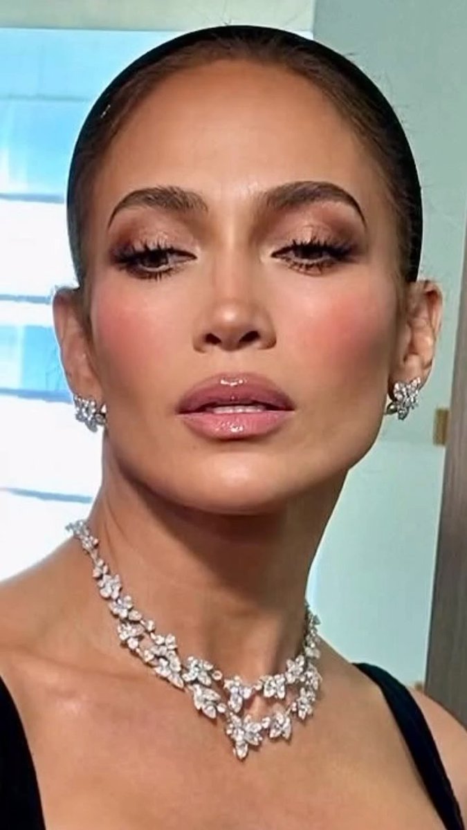 Jennifer Lopez knows how to make an entrance - even as a wedding guest 🖤 The superstar, 56, shared her glam look from Taylor Swift and Travis Kelce’s big day, stepping out in a black party dress, sparkling diamonds and sky-high heels - and toasting the occasion with a simple “🥂” 📸: #jlo #jenniferlopez #weddingstyle #taylorswift traviskelce