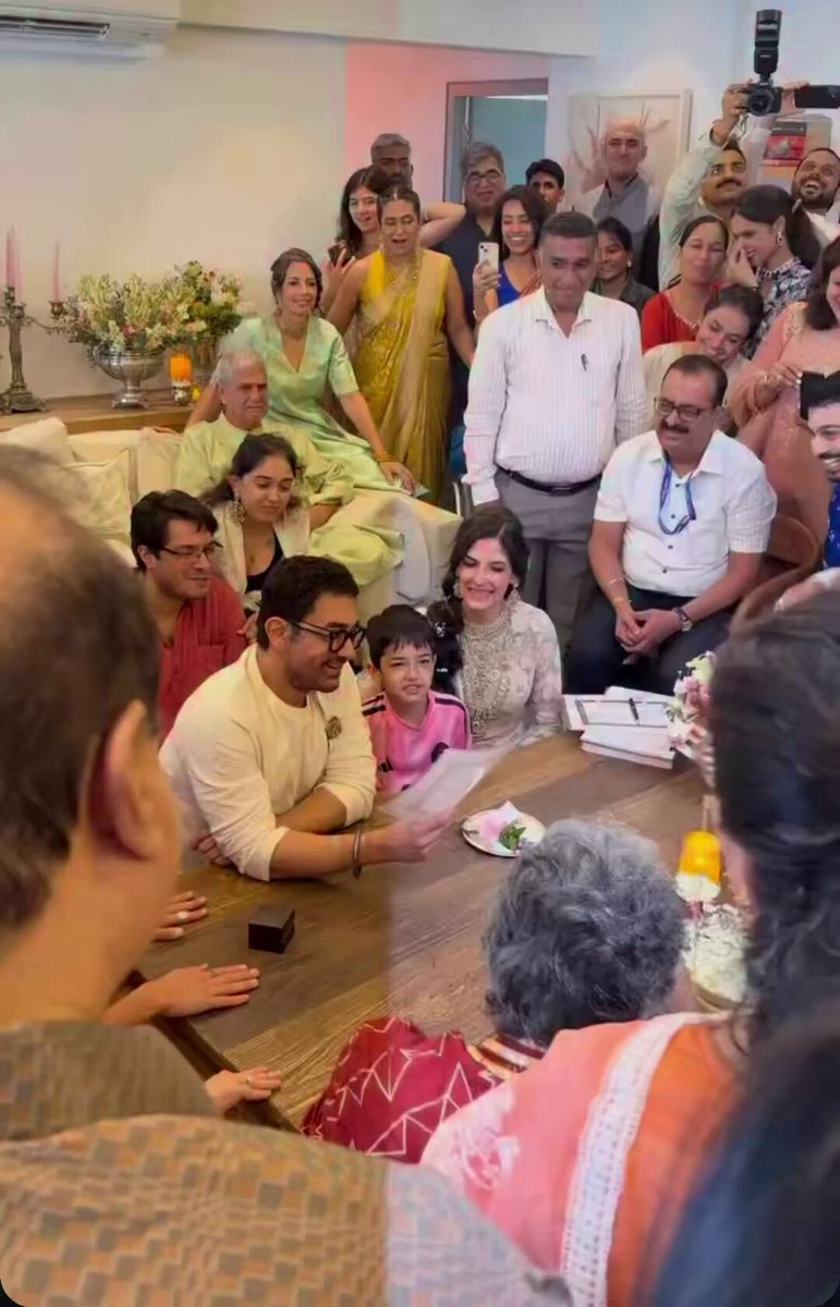 Aamir Khan signs his marriage contract with Gauri Spratt in the presence of his first wife, his second wife, his son and his daughter.