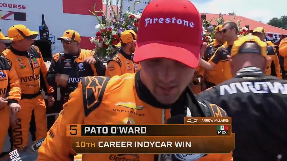 Pato O'Ward talks with Georgia Henneberry after winning at Mid-Ohio.